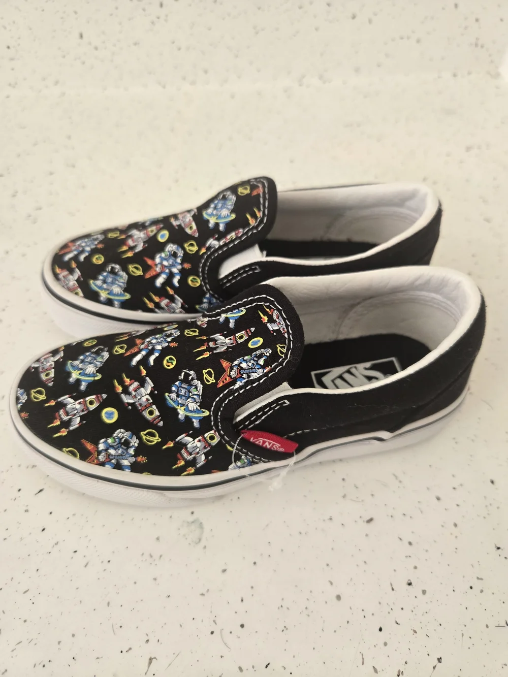 Vans Kids Slip-On Sneakers in Black with Multicolor Robot Print